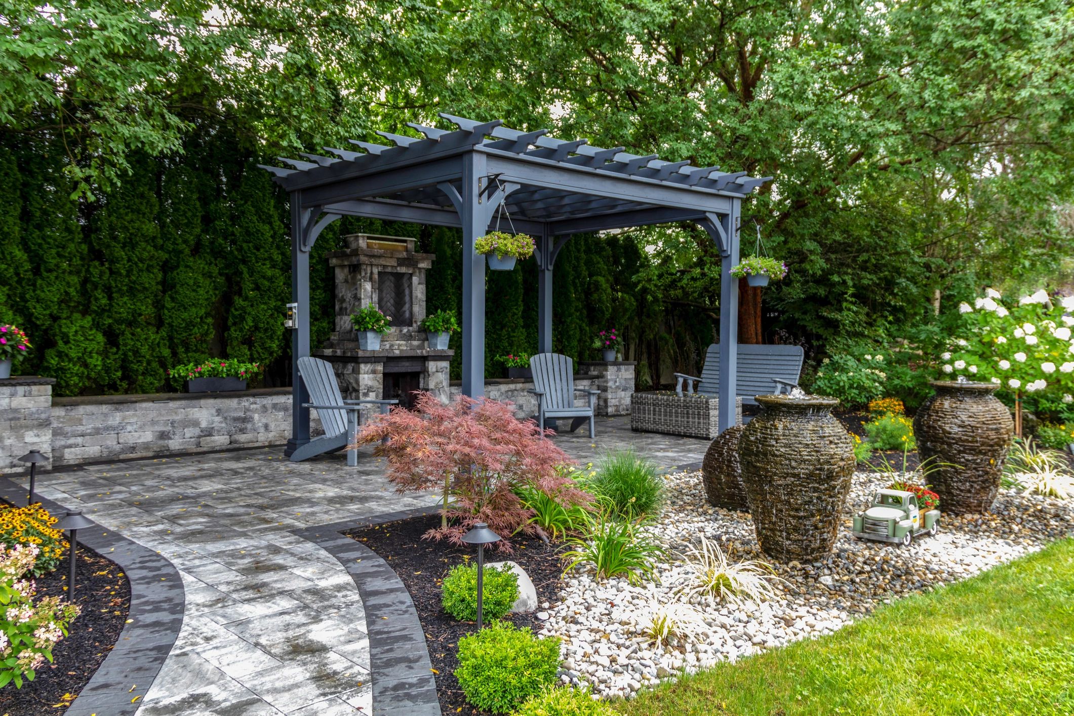 Custom outdoor fireplace installation by J&R Maintenance Corp.